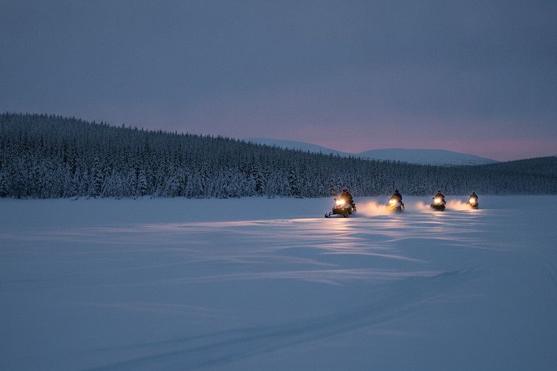 A snowmobile safari on a frozen lake near Rovaniemi